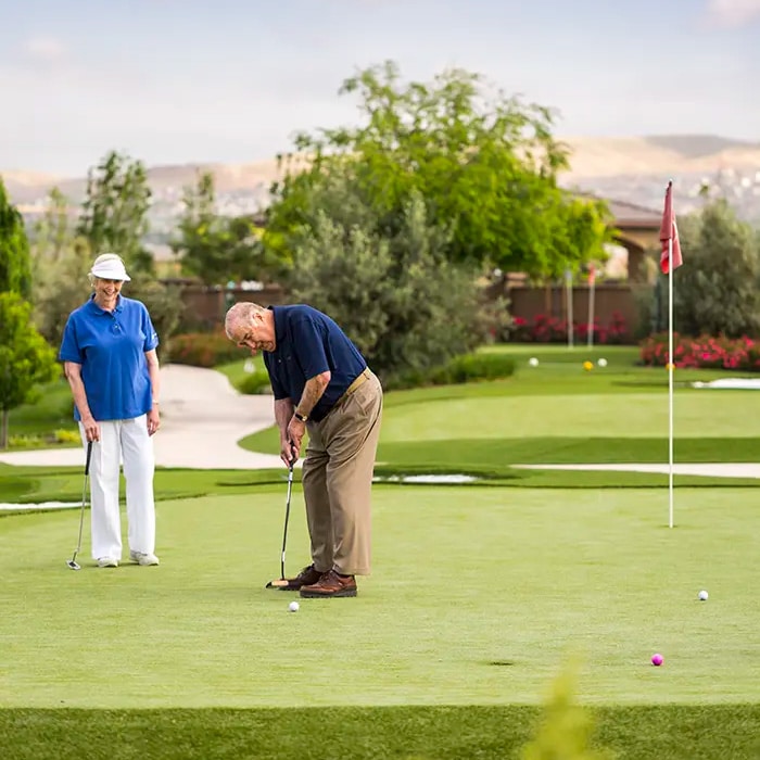 Two elderly men playing golf at Stoneridge Creek